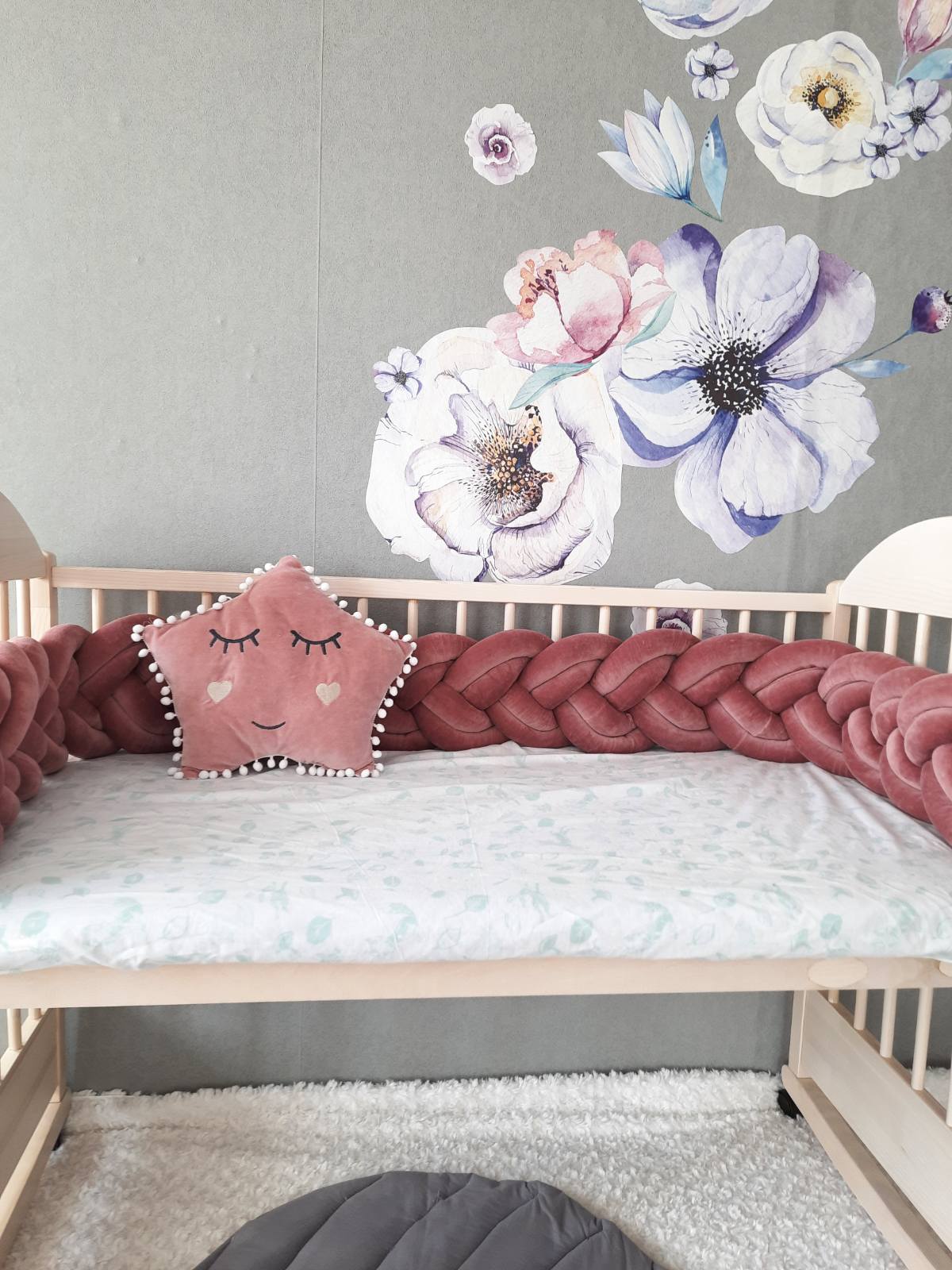 Fresia double braided crib bumpers with gold gray star pillow on the crib. Front side