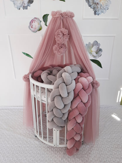 Oval crib with rose canopy with pom poms. Rose and gray Braided Crib Bumpers - Weaving in 4 Strips on the crib. Front side.