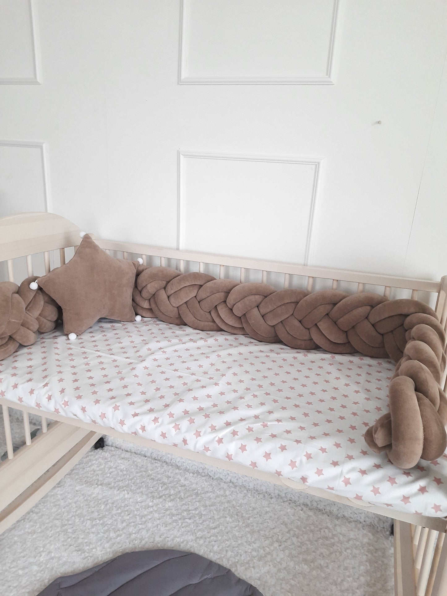 Brown double braided bumper with brown star pillow as a gift on the crib. 100% velor cotton braided crib bumper. Hypoallergenic material with OEKO-TEX certificate
