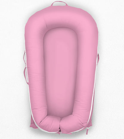 Pink DockATot, white background, front side