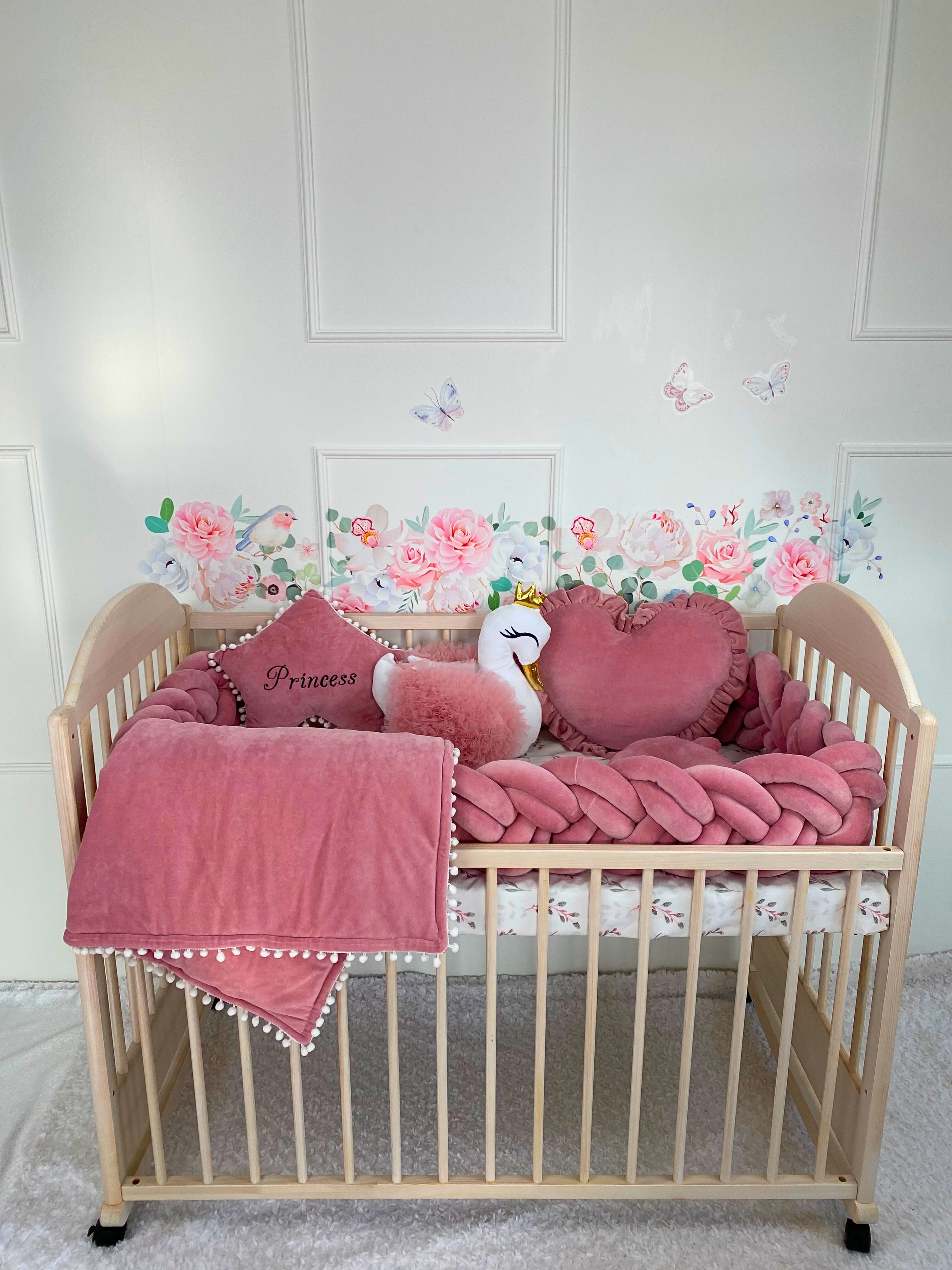 Rose crib set. Double braided bumper with 3 free pillows: swan, heart and star with custom embroidery and blanket. Wooden crib with set against the wall in nursery