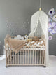 Crib set in cream and white colors. Double cot bumper, swan, cloud, star pillows, blanket and canopy. Front side