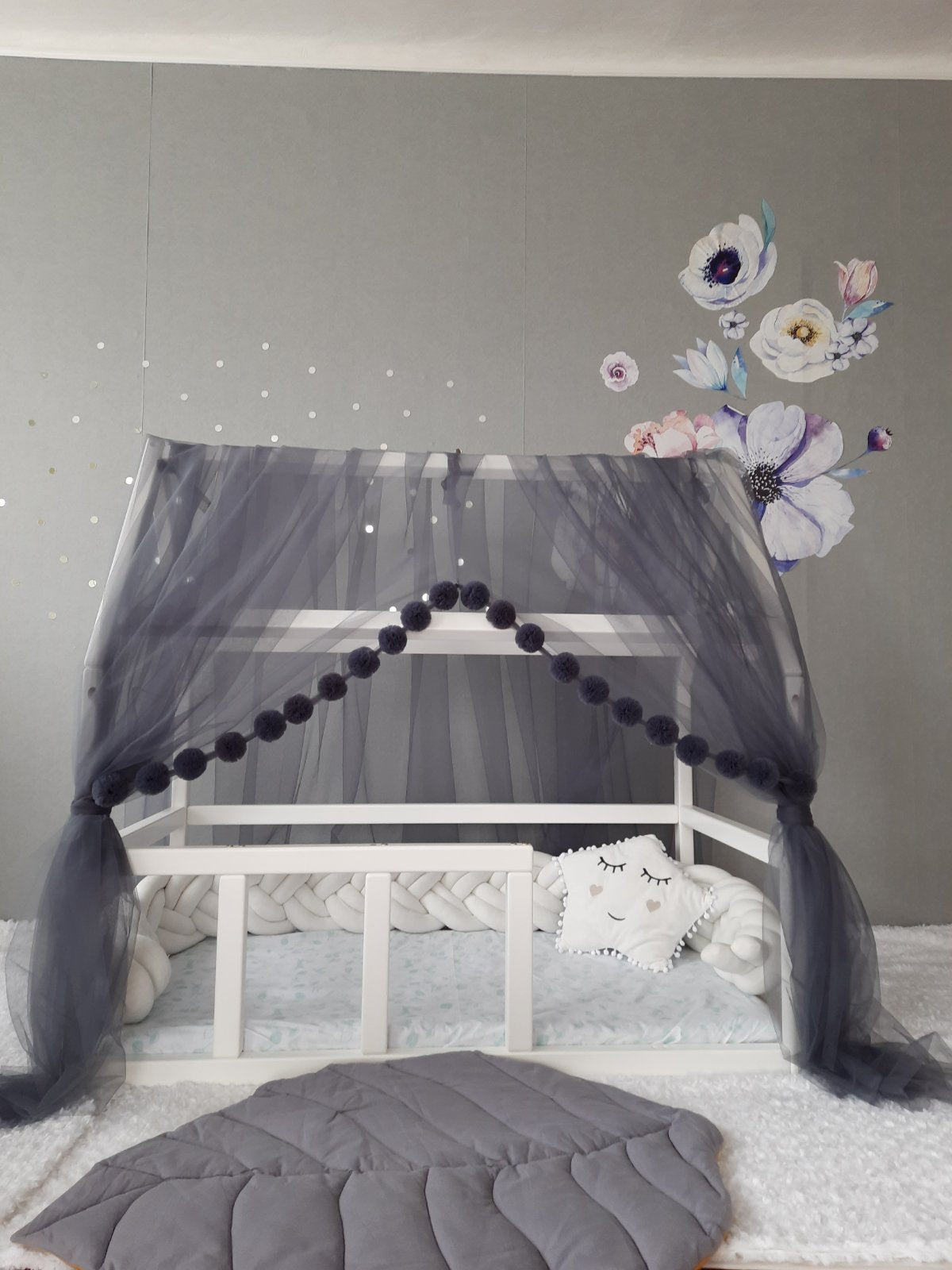 Dark gray montessori canopy with pompoms for nursery