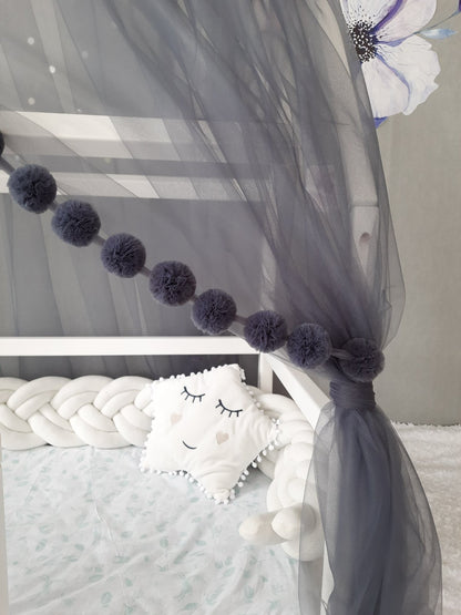 Dark gray montessori canopy pompoms.