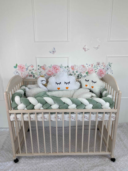 Best crib set for babies. Star, swan and cloud plush pillows in white color. Braided cot bumper in white and green colors. Baby nest in green and white colors. 