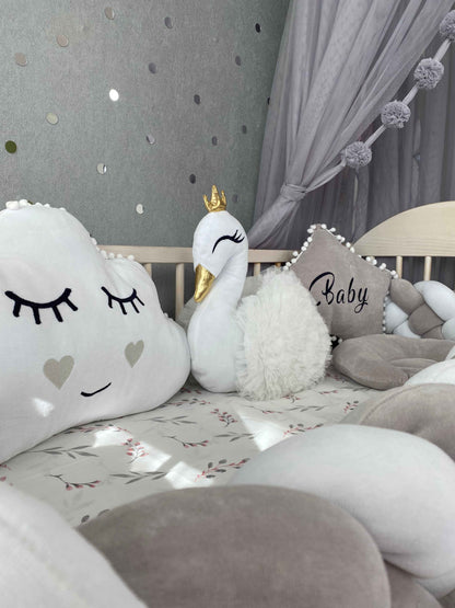 Three plush pillows including in light gray crib set 