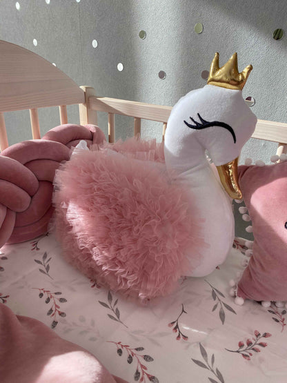 White swap pillow with rose wings on the crib. Plush handmade swan pillow 