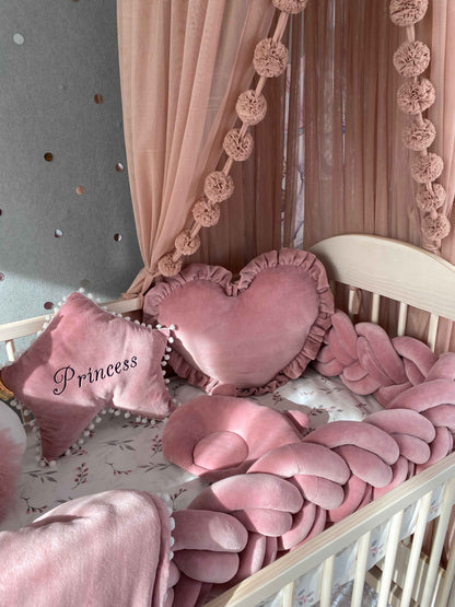 Star, heart and orthopedic infant pillows againt canopy. Ideal crib set fro nursery. 