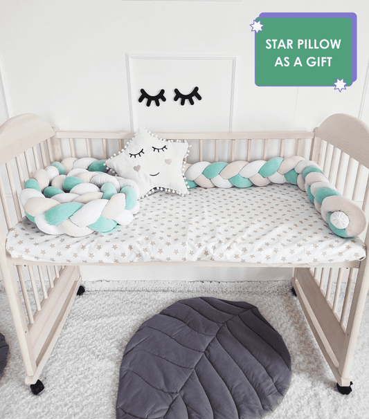 Triple Weaving Crib Bumper in white, mint and light pink colors with white star pillow on crib. Star pillow as a gift. Front side