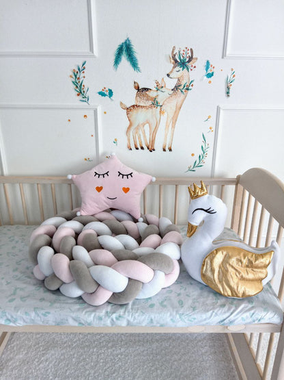 Triple Weaving Crib Bumper in white, gray and light pink colors with light pink star pillow and white swan pillow on crib. Front side