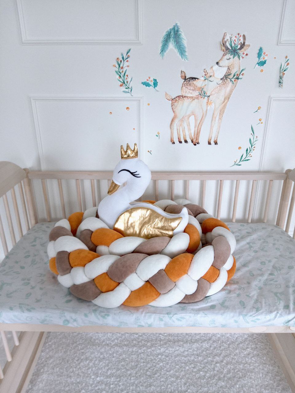 Braided Crib Bumper - Weaving in 4 Strips with swan pillow on the crib in nursery. Front side