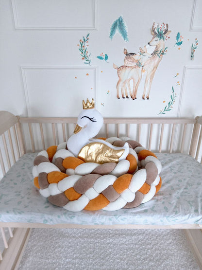 Braided Crib Bumper - Weaving in 4 Strips with swan pillow on the crib in nursery. Front side