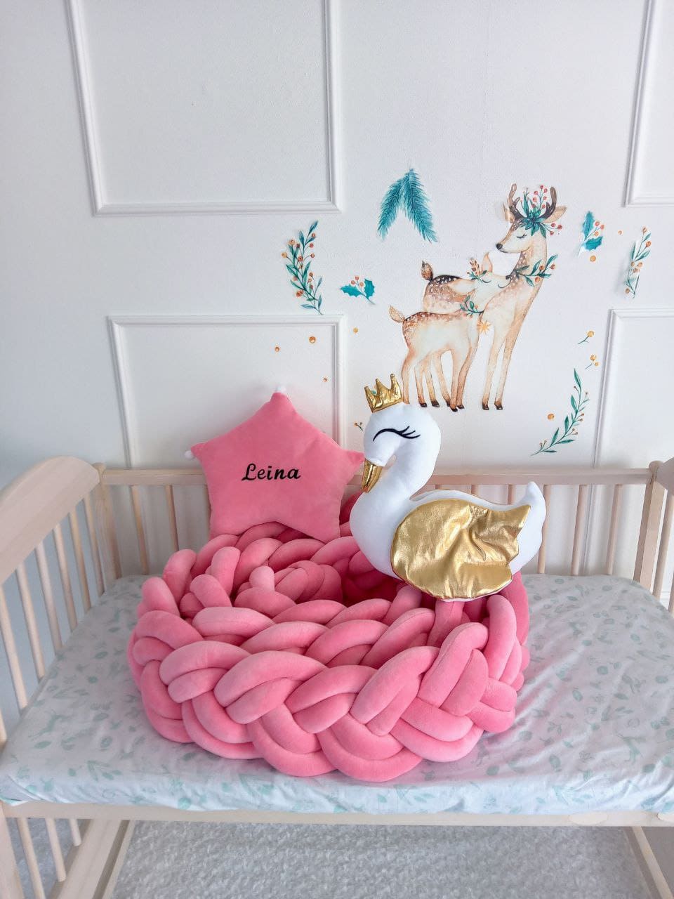 Barbie braided cot bumper, barbie star pillow and white swan pillow on the crib. Allbright Kids best nursery products