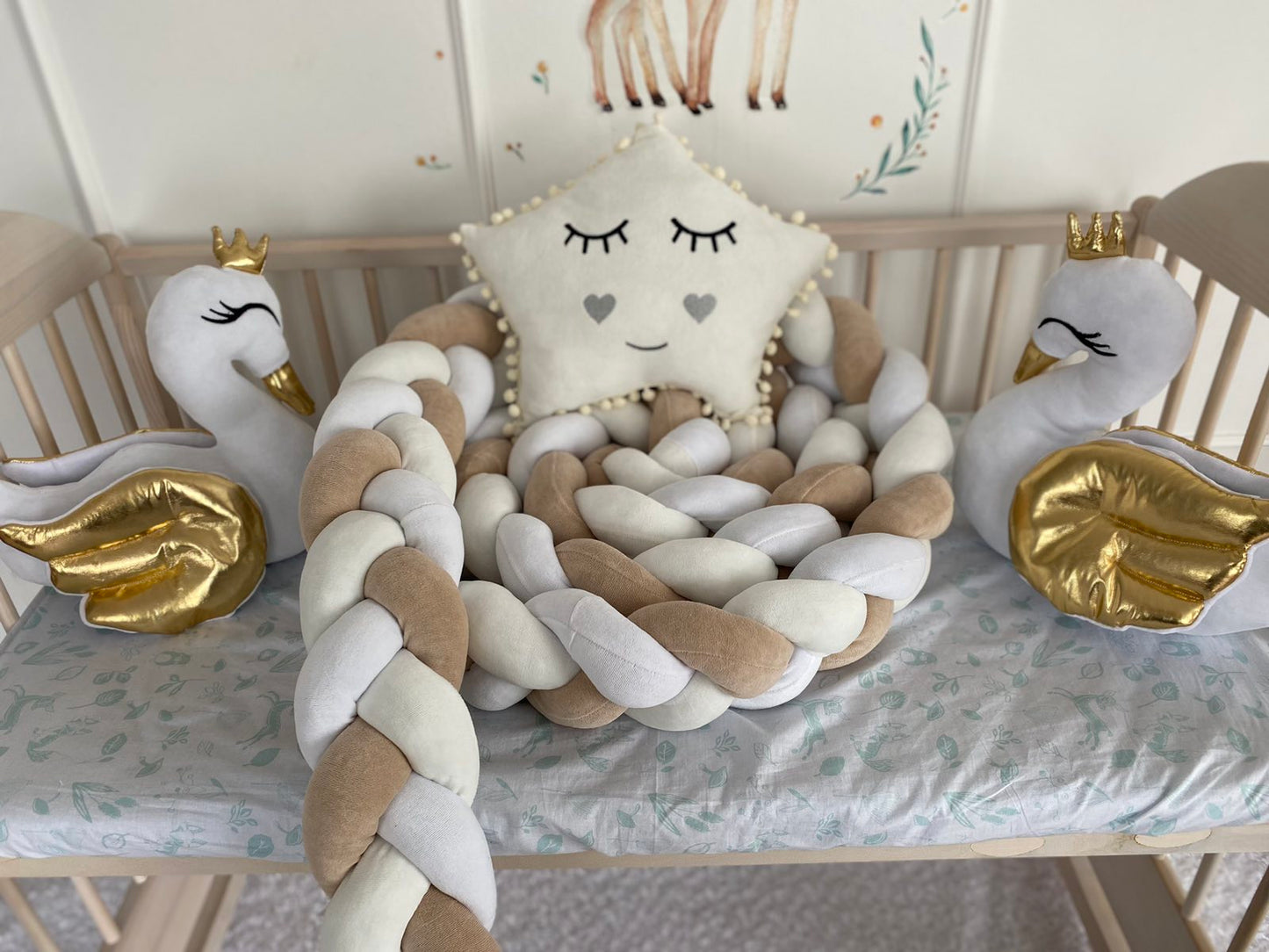 White-Milk-Coffee Braided Crib Bumper - Weaving in 3 Strips, two swan pillows and star pillow in milk color on the crib.